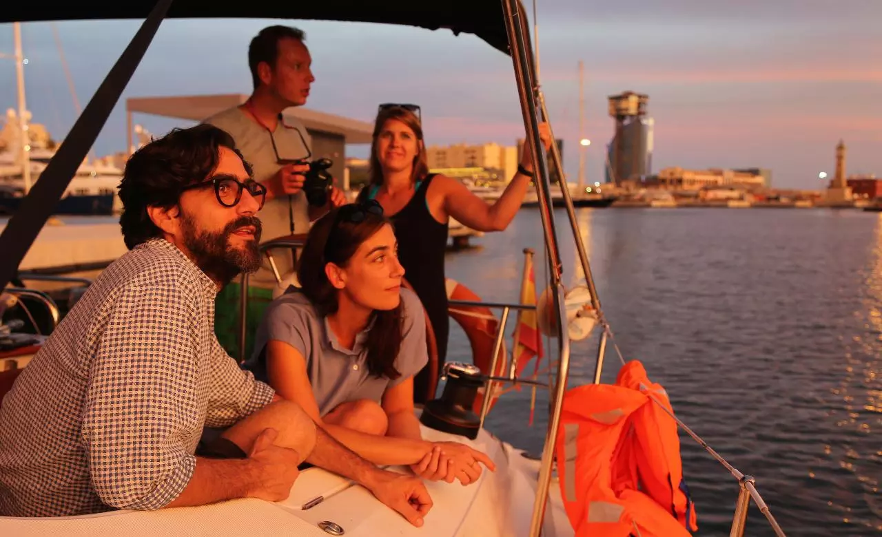 People watching the sunset from a yacht in Barcelona